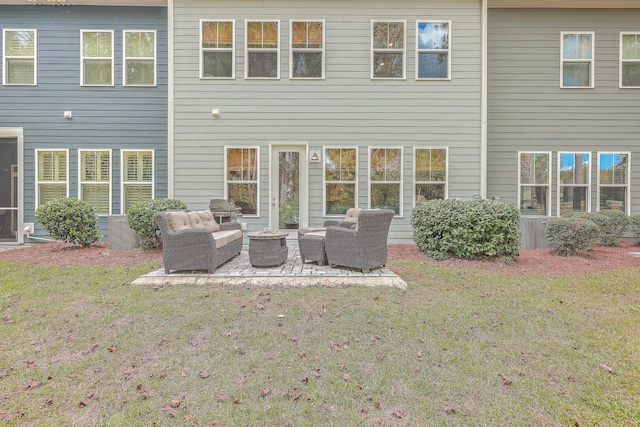 back of property featuring an outdoor living space, a yard, and a patio