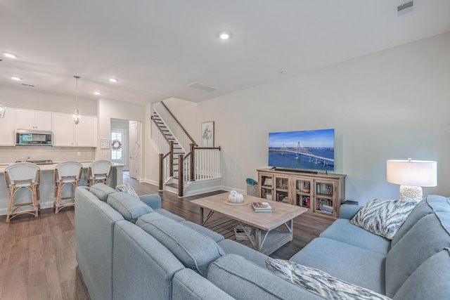 living room with dark hardwood / wood-style floors