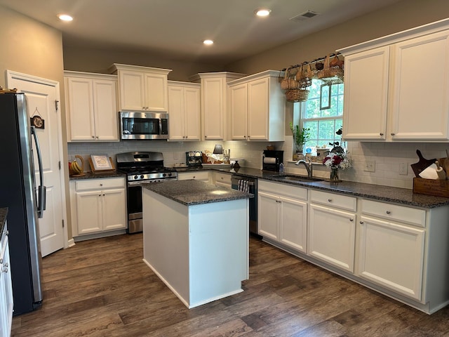 677 Redbud Ln, Summerville, SC 29486 - kitchen featuring stainless steel appliances, a sink, white cabinetry, recessed lighting, and decorative backsplash