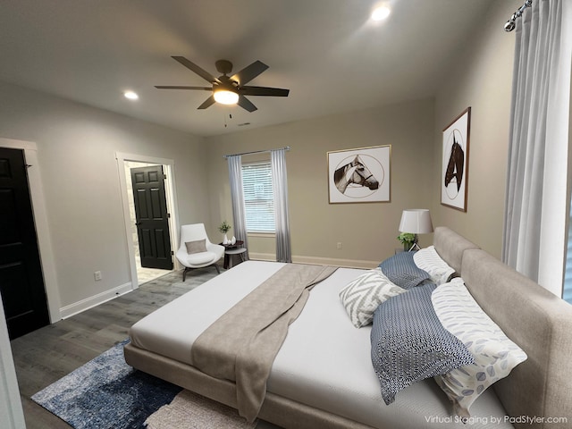 bedroom with ceiling fan and dark wood-type flooring