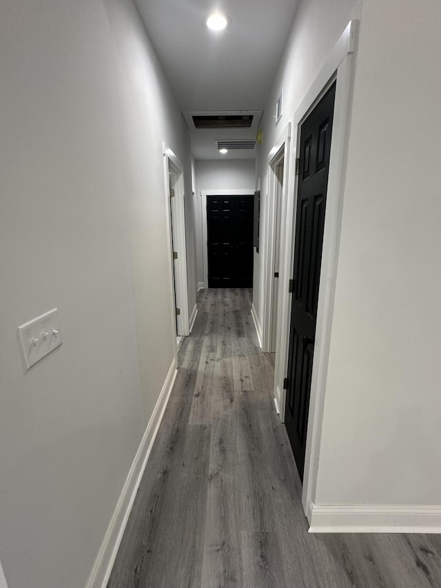 hallway featuring wood-type flooring