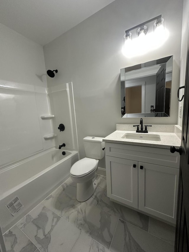 full bathroom featuring vanity, bathtub / shower combination, and toilet