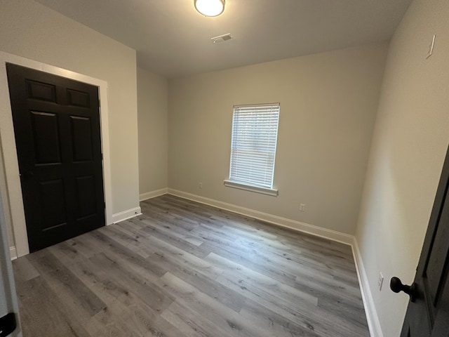 unfurnished room featuring light wood-type flooring