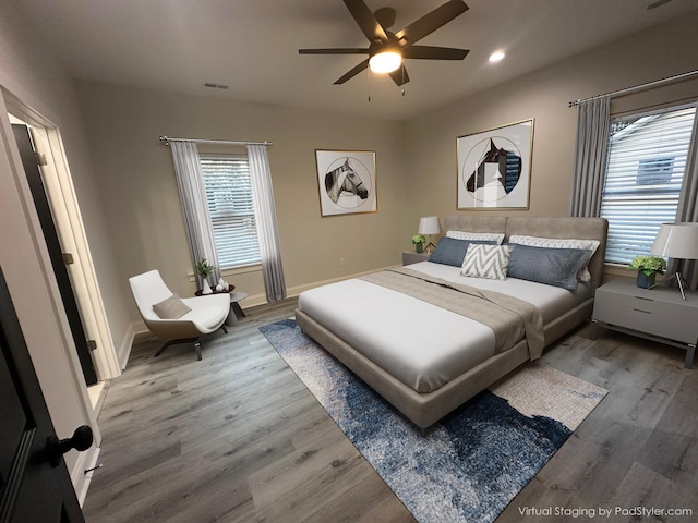 bedroom featuring ceiling fan and wood-type flooring