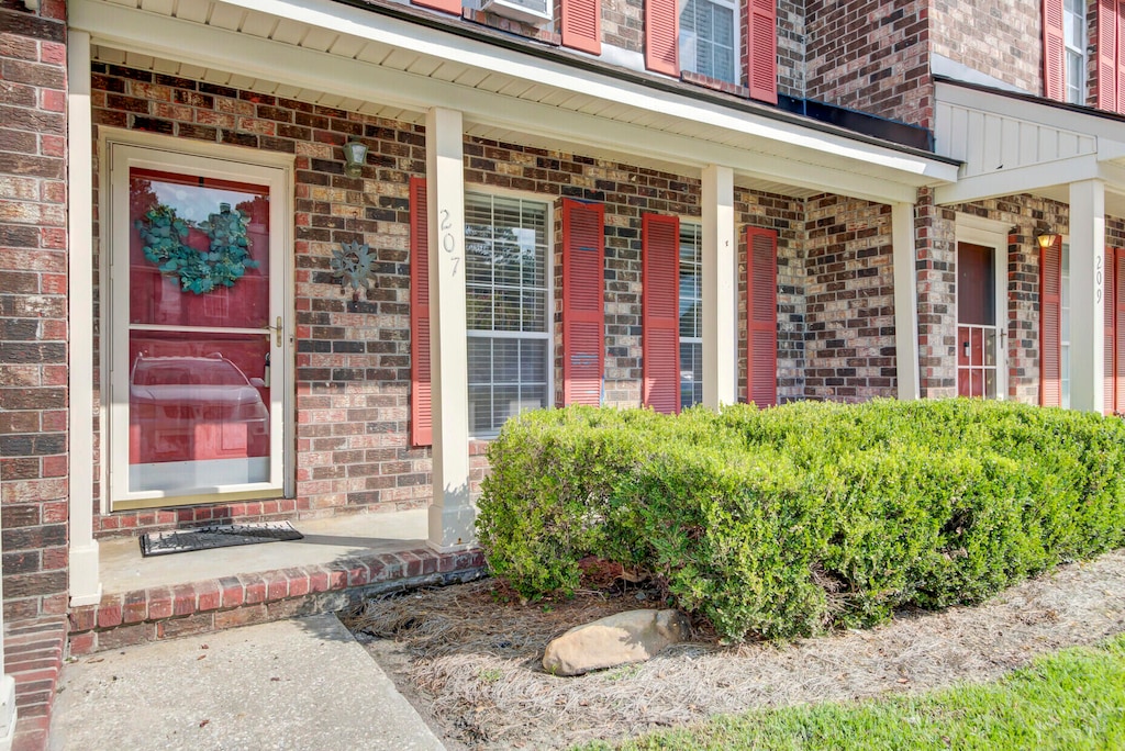 doorway to property featuring covered porch