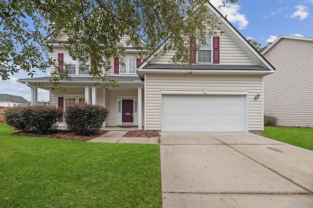 view of property with a front lawn and a garage