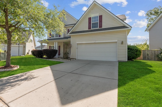 view of front of property with a garage and a front lawn