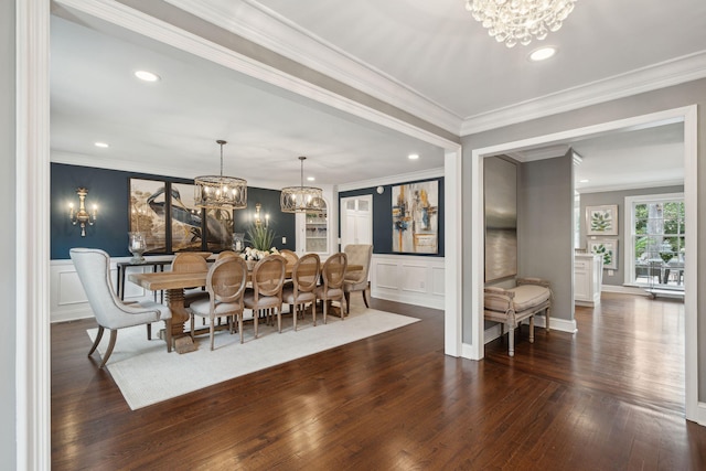 dining room with crown molding, a notable chandelier, dark wood-style floors, and recessed lighting