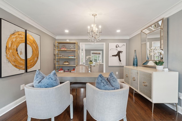 interior space with a notable chandelier, wood finished floors, and ornamental molding