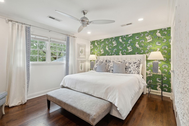 bedroom featuring wallpapered walls, wood finished floors, visible vents, and ornamental molding