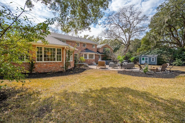 view of yard featuring a patio area, an outdoor living space with a fire pit, an outdoor structure, and a shed