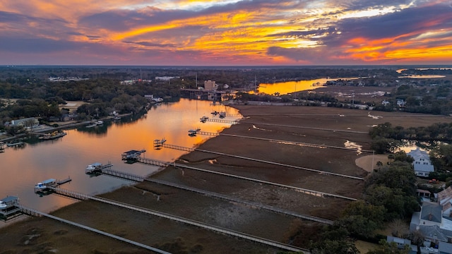 aerial view at dusk with a water view