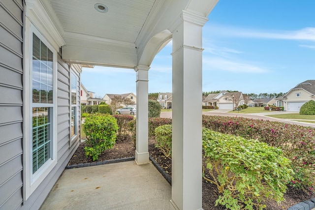 view of patio / terrace with covered porch and a residential view