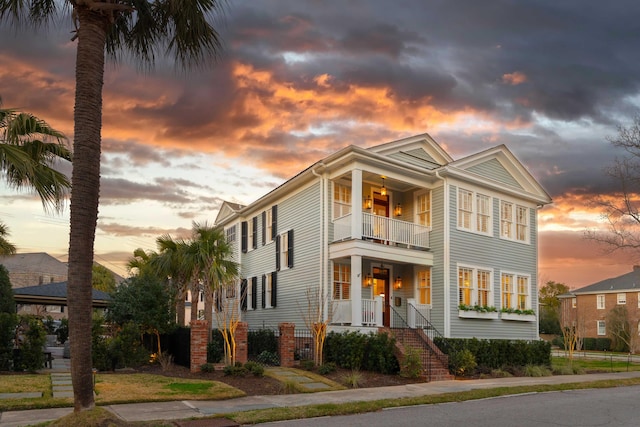 view of front of home with a balcony