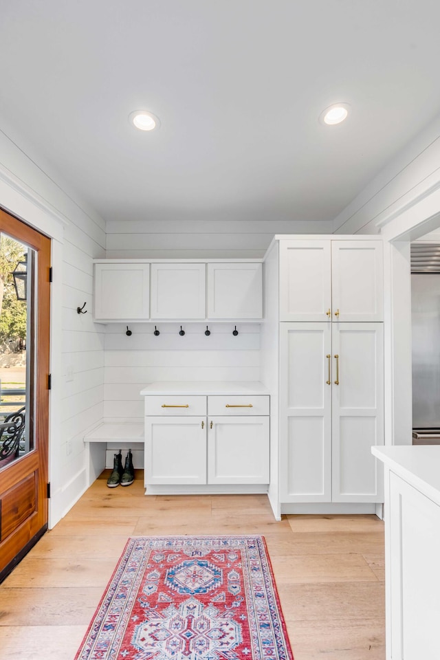 mudroom featuring light wood-style flooring and recessed lighting