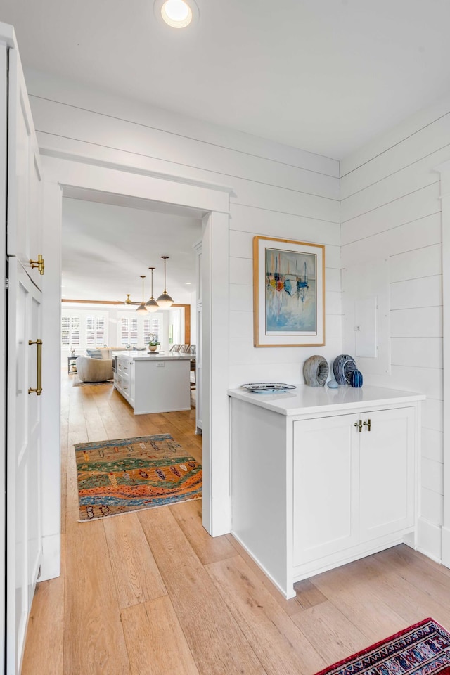 hallway featuring light wood-style flooring