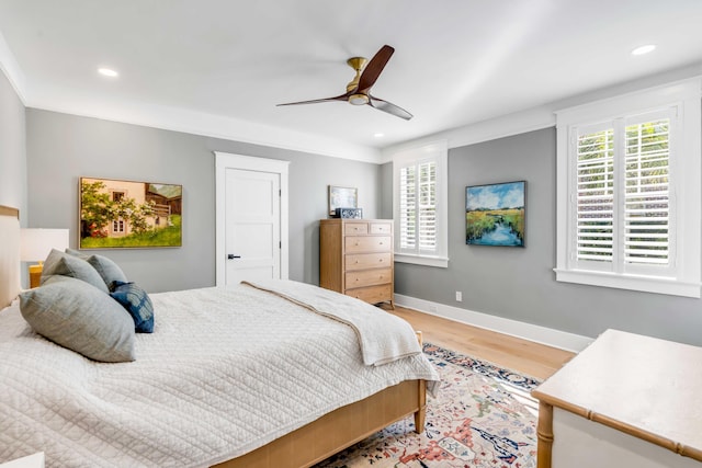 bedroom featuring light wood-style floors, ceiling fan, baseboards, and recessed lighting