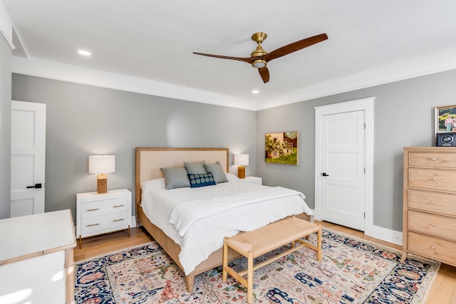 bedroom with light wood-style flooring, baseboards, a ceiling fan, and recessed lighting