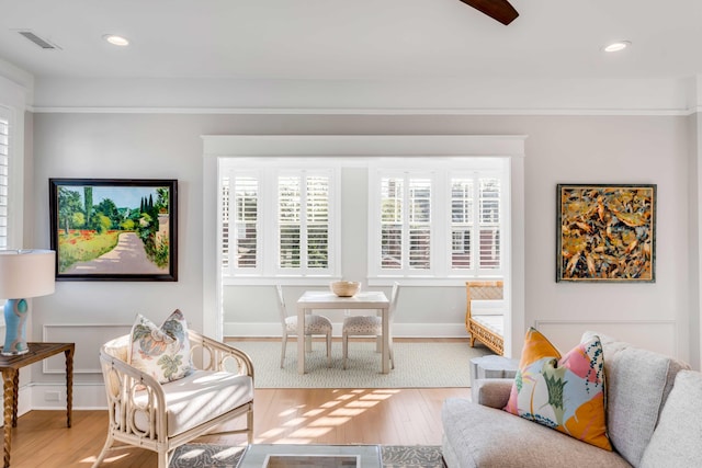 living area featuring wood finished floors, visible vents, and recessed lighting