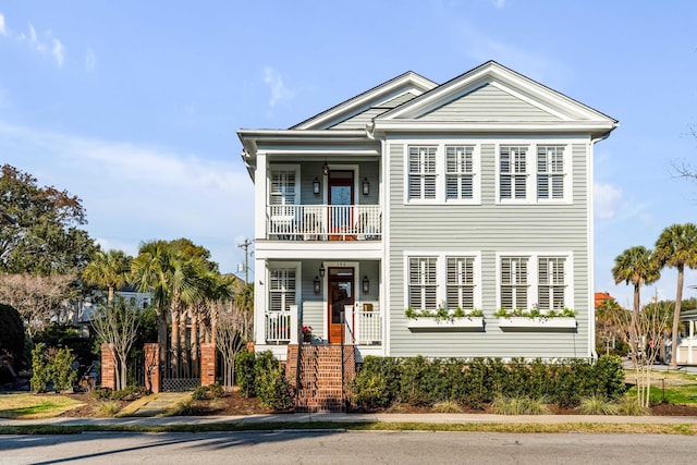 view of front of property with a balcony and a porch