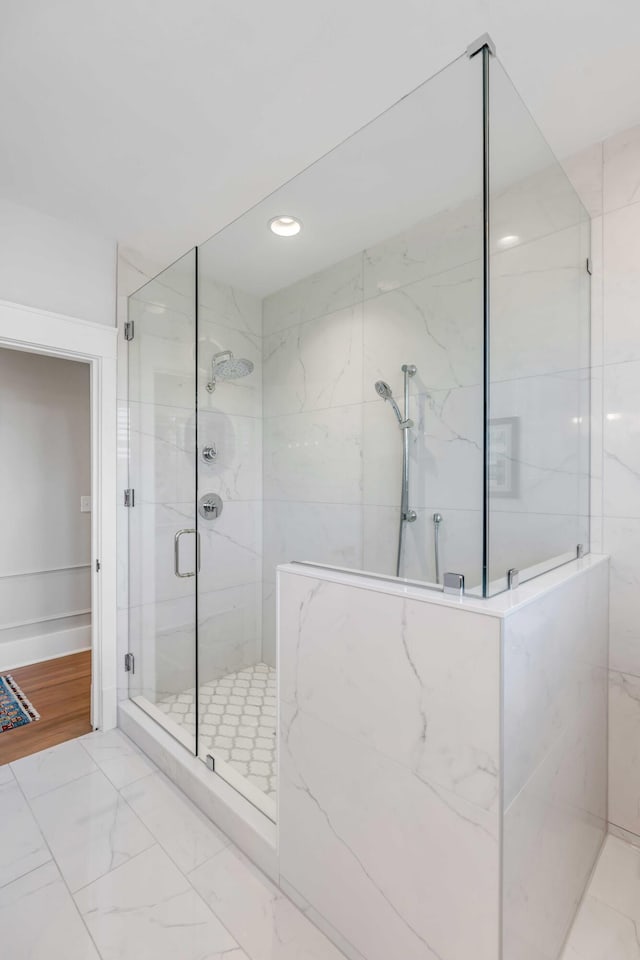 full bathroom with marble finish floor, a marble finish shower, and recessed lighting