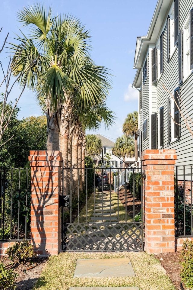 view of gate with fence