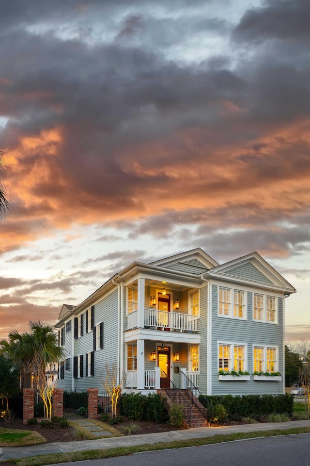 view of front facade featuring a porch and a balcony