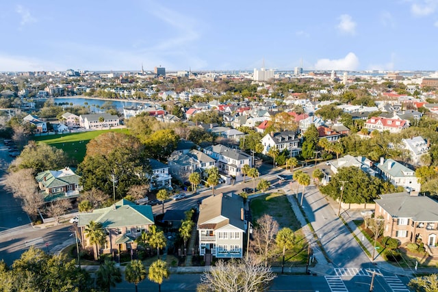 bird's eye view featuring a water view and a residential view