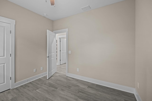 unfurnished bedroom featuring light hardwood / wood-style flooring and ceiling fan