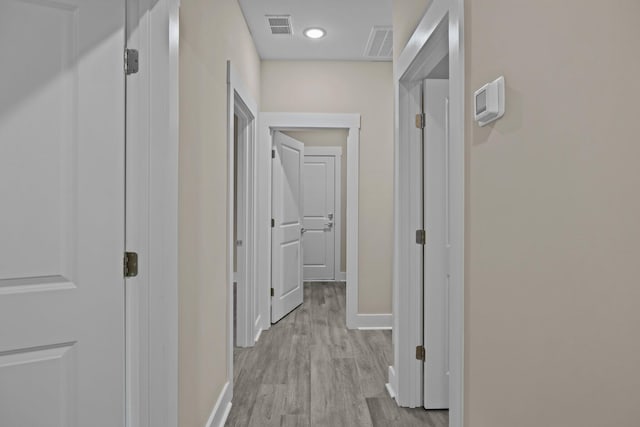 hall with light wood-type flooring