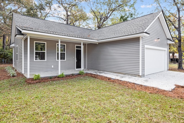 single story home with a porch, a front lawn, and a garage