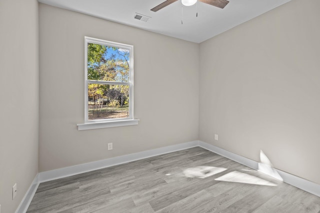 empty room with light hardwood / wood-style flooring and ceiling fan