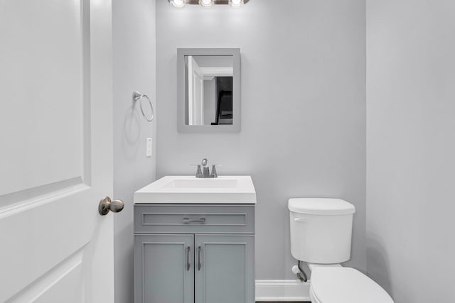 bathroom with toilet and vanity