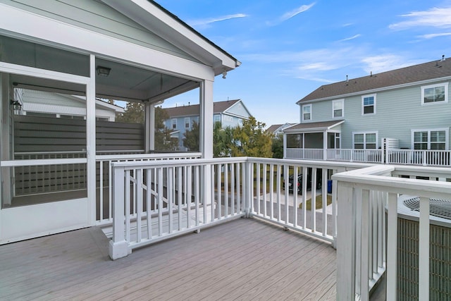 deck with a sunroom