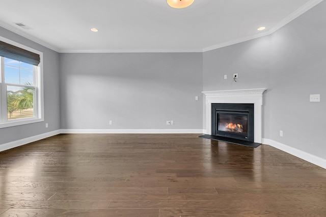 unfurnished living room with crown molding and dark hardwood / wood-style floors