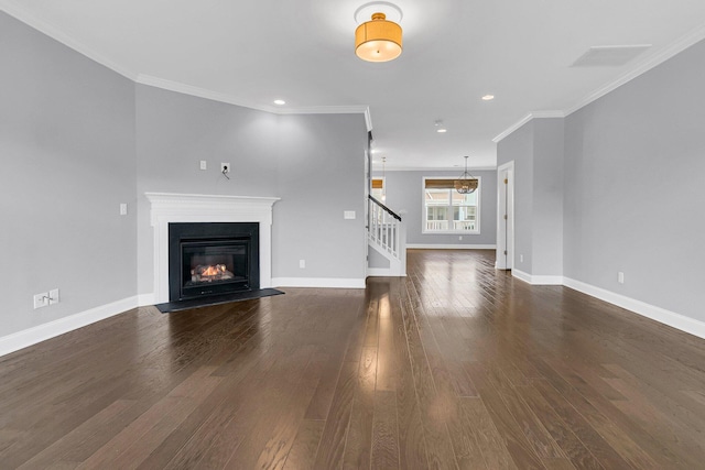 unfurnished living room with ornamental molding and dark wood-type flooring