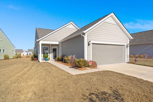 view of front facade featuring a garage and a front lawn