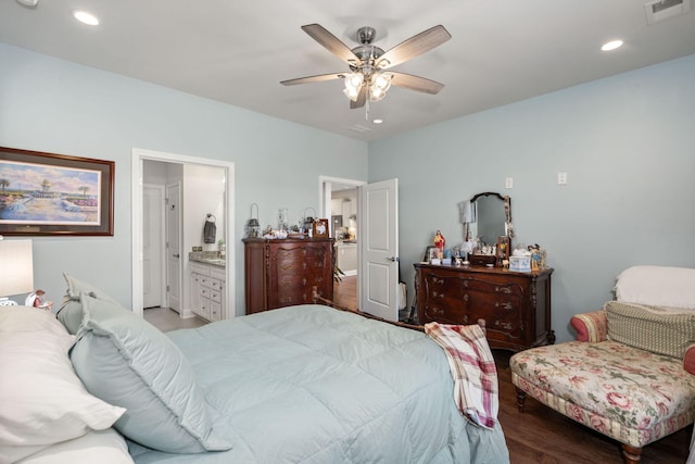 bedroom with ceiling fan, light hardwood / wood-style floors, and connected bathroom