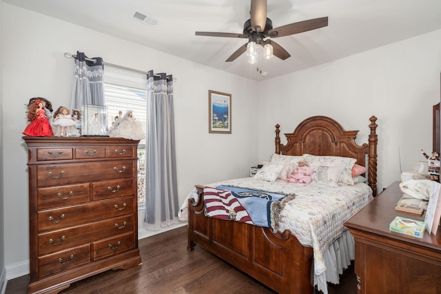 bedroom featuring dark hardwood / wood-style flooring and ceiling fan