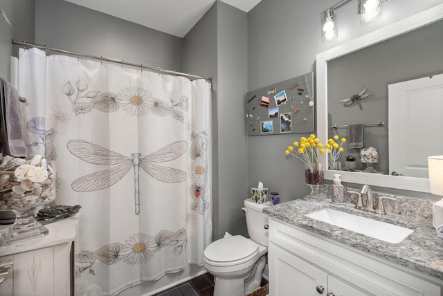 bathroom with toilet, a shower with shower curtain, and vanity