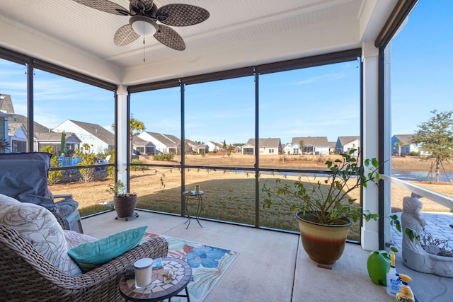 sunroom / solarium featuring ceiling fan and plenty of natural light