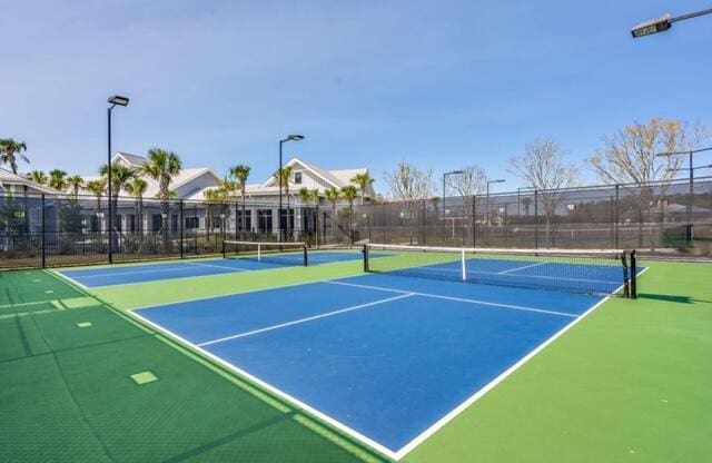 view of sport court featuring basketball hoop