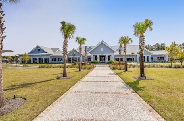 ranch-style home with a front yard