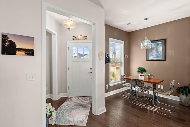 foyer with dark hardwood / wood-style flooring