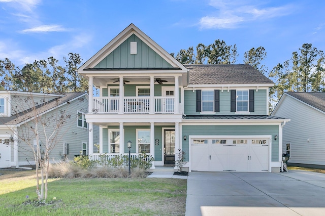 view of front facade with a front lawn, a garage, a balcony, and a porch