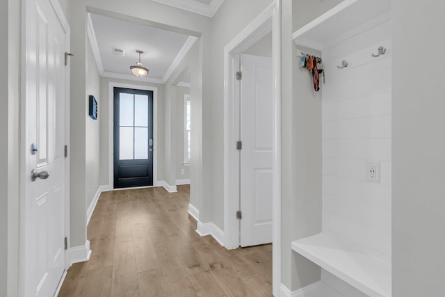 mudroom featuring ornamental molding and light hardwood / wood-style flooring
