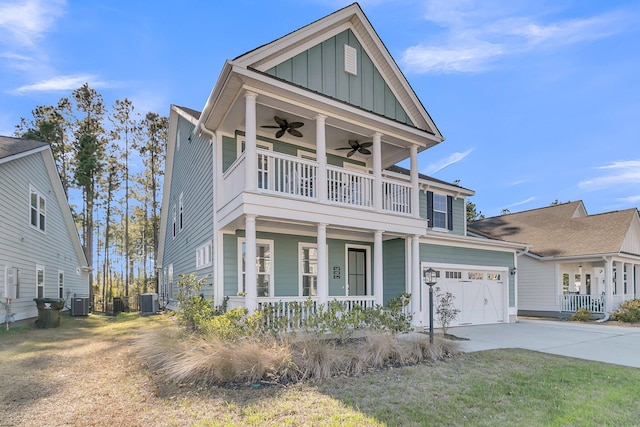 view of front of property with central AC unit, a garage, a balcony, and ceiling fan