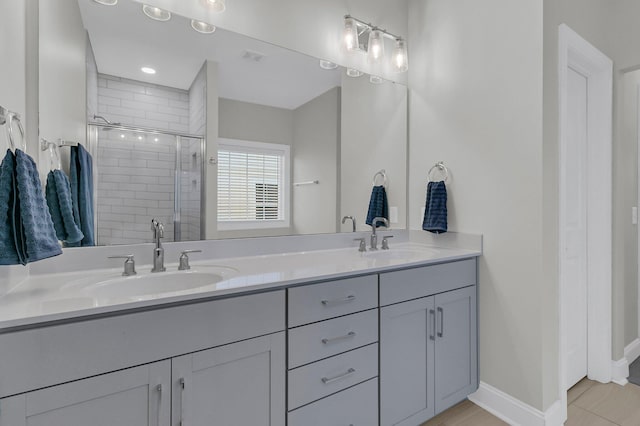 bathroom featuring vanity and an enclosed shower
