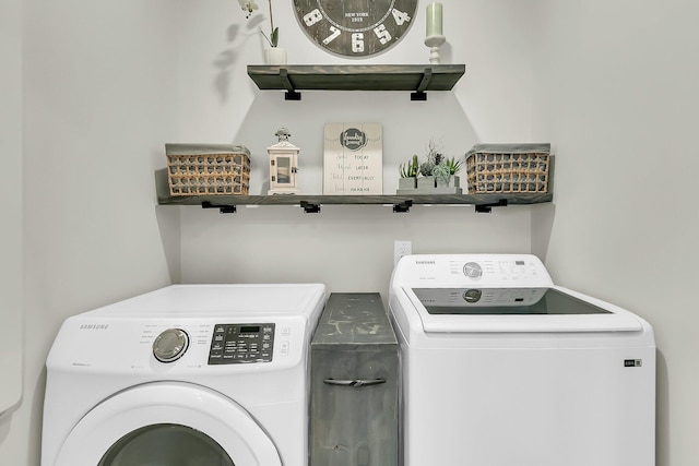 laundry area with washing machine and clothes dryer