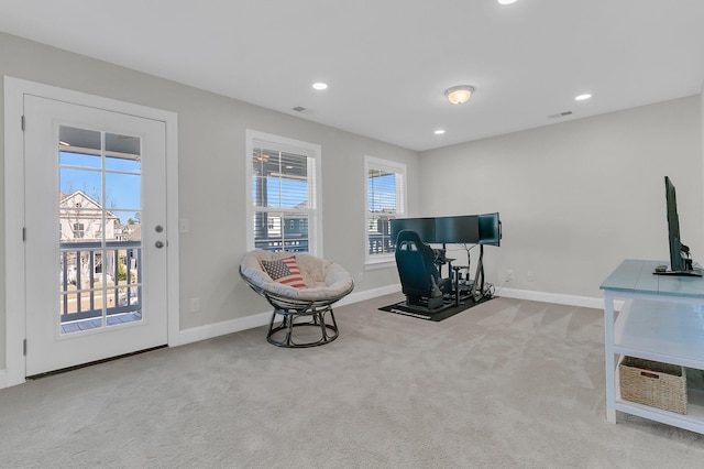 sitting room featuring light colored carpet